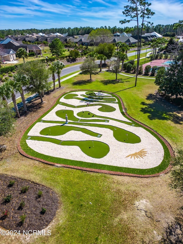 view of home's community with a residential view and a lawn