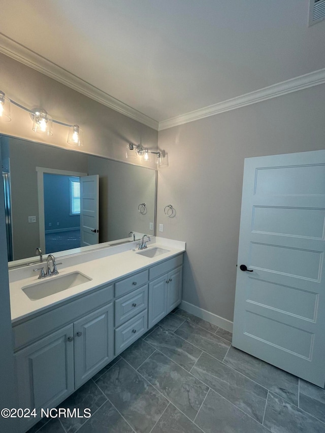 bathroom featuring vanity and ornamental molding