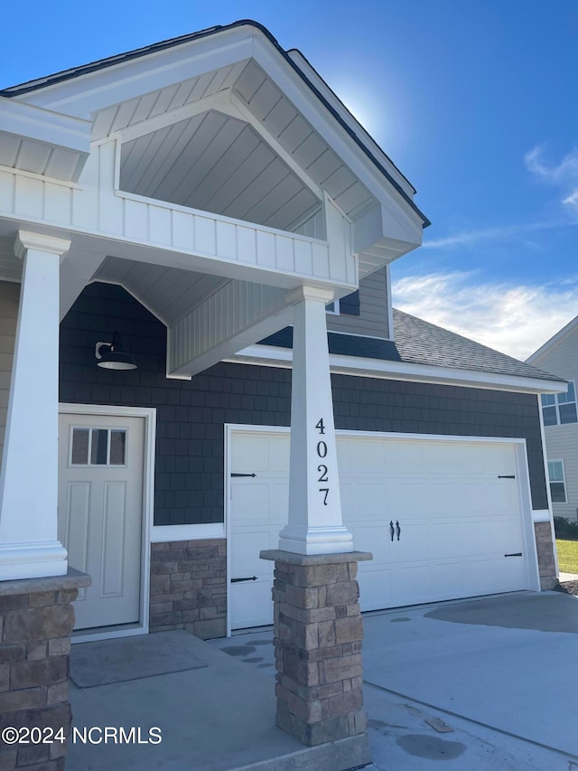 entrance to property featuring a garage