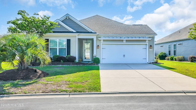 craftsman-style home featuring an attached garage, a front lawn, and driveway