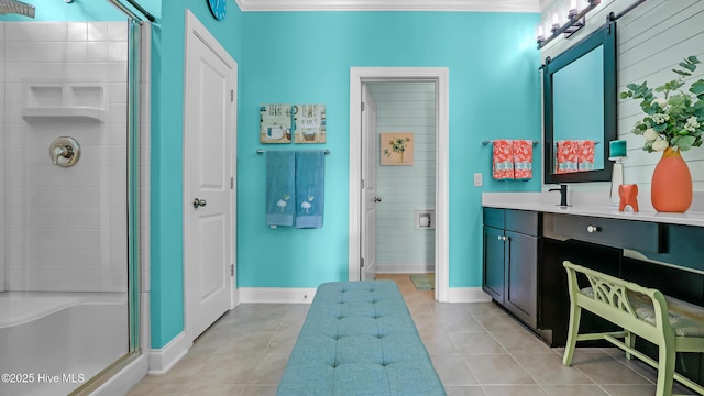 bathroom featuring baseboards, a shower stall, and tile patterned floors