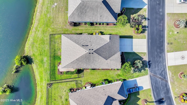 drone / aerial view with a water view