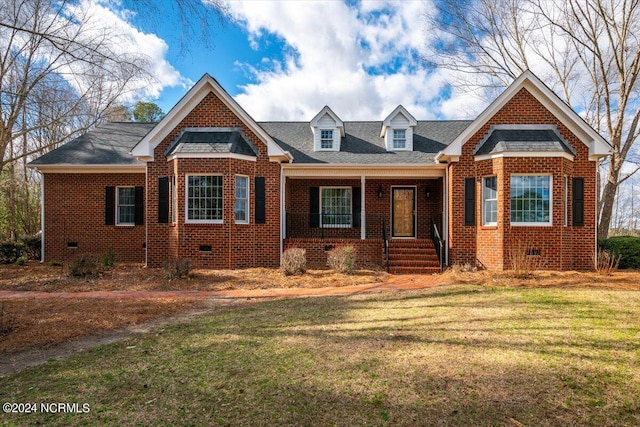 view of front of home featuring a porch and a front lawn