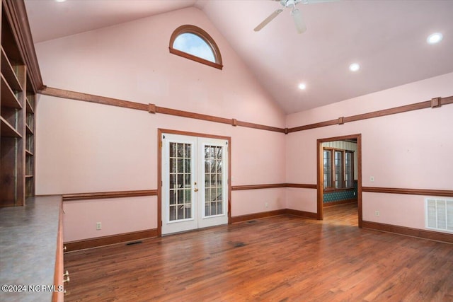 unfurnished room with french doors, high vaulted ceiling, ceiling fan, and dark wood-type flooring