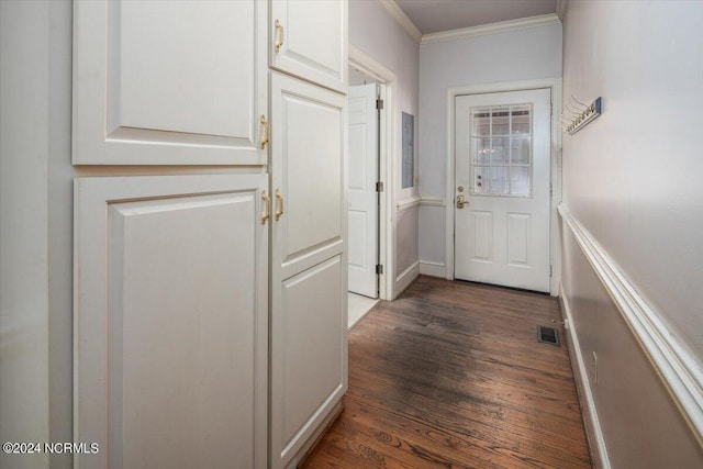 doorway to outside with dark hardwood / wood-style flooring and ornamental molding