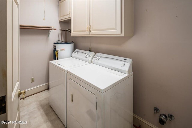 washroom featuring separate washer and dryer, gas water heater, and cabinets