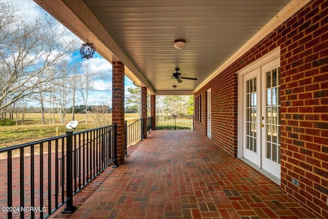 view of patio featuring ceiling fan, french doors, and a porch