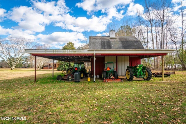 view of outdoor structure featuring a yard and a carport