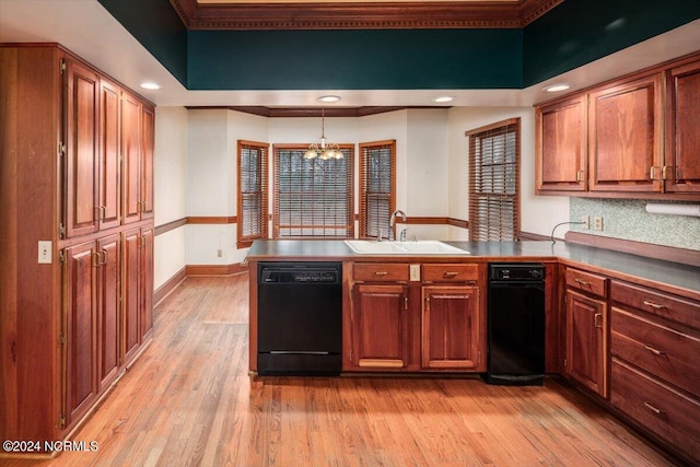 kitchen with dishwasher, kitchen peninsula, an inviting chandelier, and sink