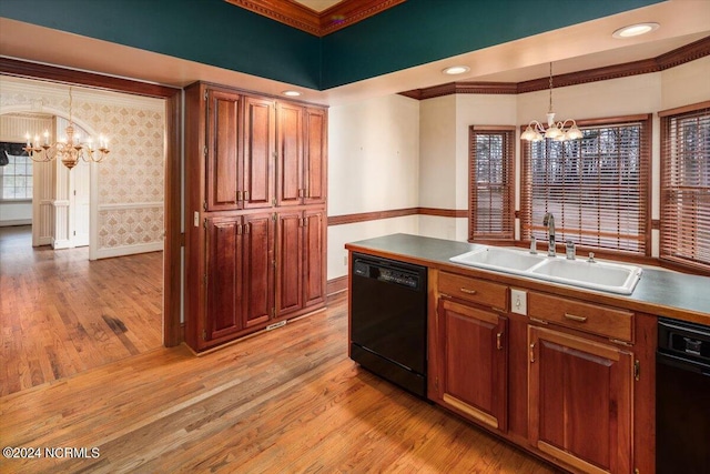 kitchen featuring pendant lighting, dishwasher, sink, light hardwood / wood-style flooring, and a notable chandelier