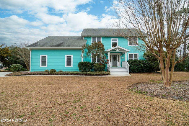 view of front of home featuring a front lawn