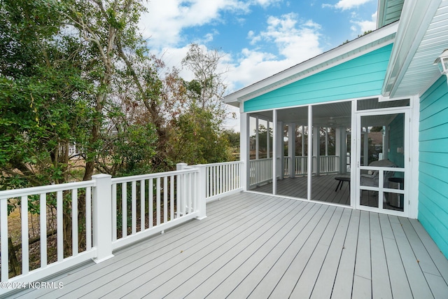 deck with a sunroom