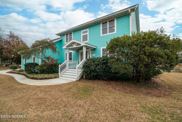 view of front facade with a front yard