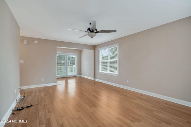 spare room with ceiling fan and light hardwood / wood-style flooring