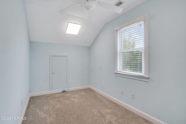 additional living space with lofted ceiling, ceiling fan, and light carpet