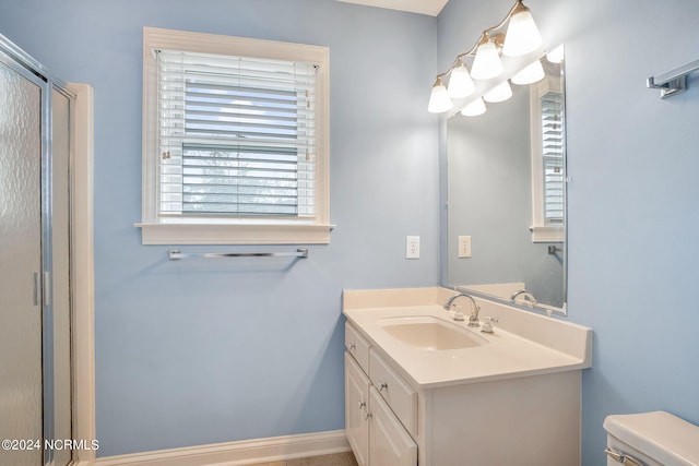 bathroom featuring oversized vanity and toilet