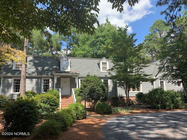 view of new england style home