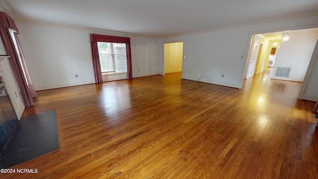 spare room featuring wood-type flooring