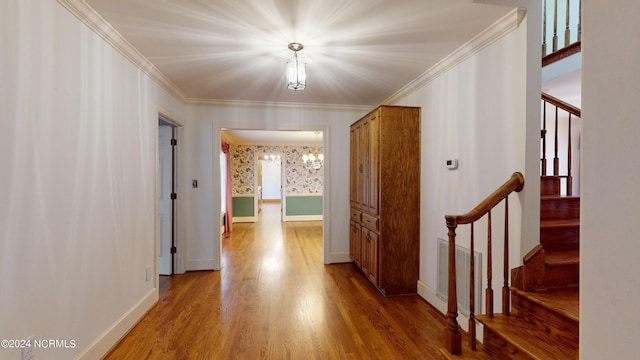 hall with crown molding and hardwood / wood-style floors