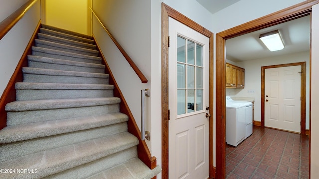 staircase featuring washing machine and dryer