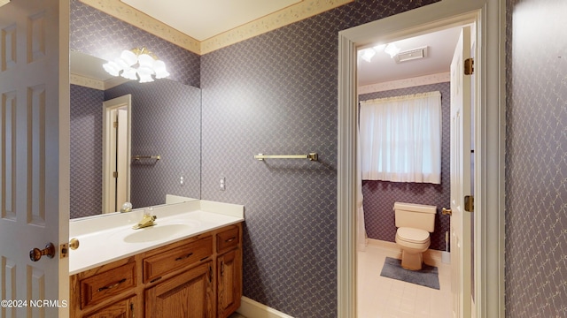 bathroom featuring oversized vanity, toilet, and tile floors