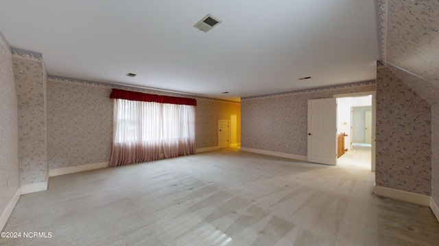 spare room with light carpet