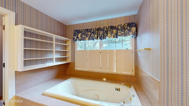 bathroom featuring a relaxing tiled bath