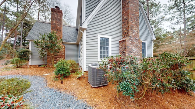 view of home's exterior with central AC unit