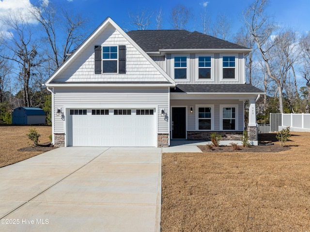 craftsman-style house with a garage and a front lawn