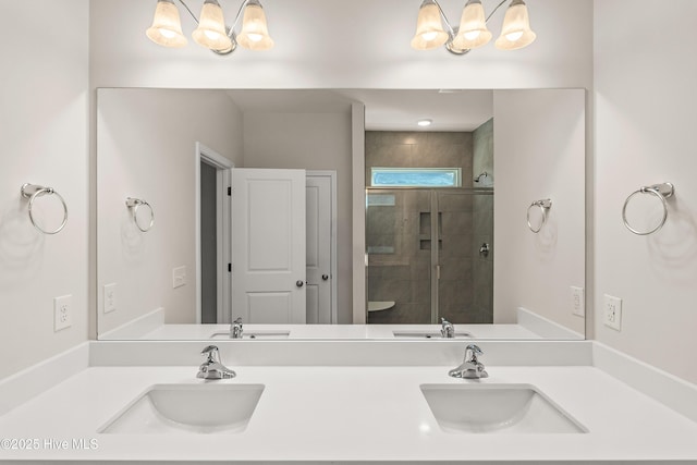 bathroom with walk in shower, vanity, and a notable chandelier