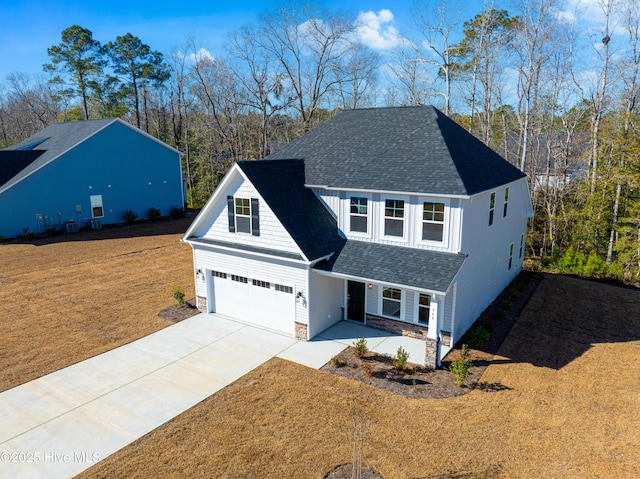 view of front of home featuring a garage and a front yard