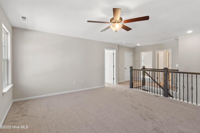 spare room with light colored carpet