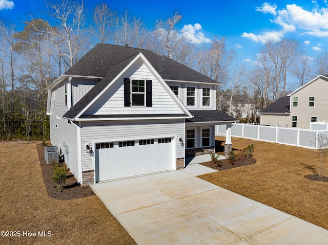 view of front of house with a garage and a front yard