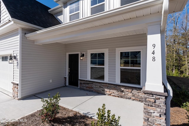 view of exterior entry featuring a garage