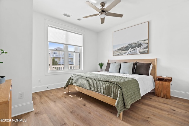 bedroom featuring ceiling fan and light wood-type flooring