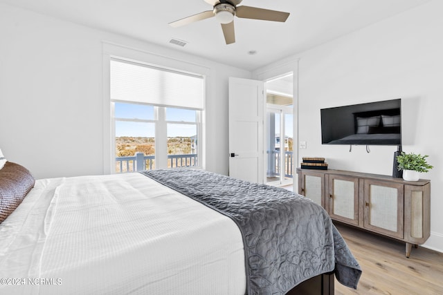 bedroom with ceiling fan and light wood-type flooring