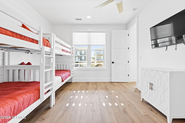 bedroom with ceiling fan and light wood-type flooring