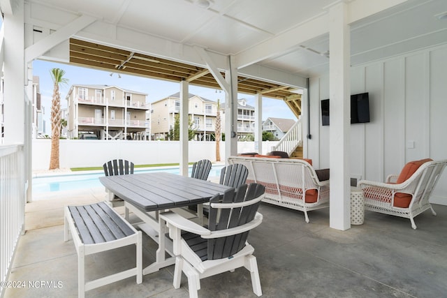 view of terrace with a fenced in pool