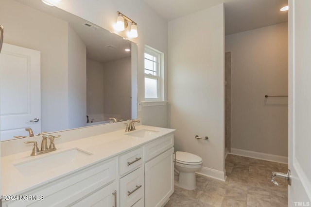 full bathroom featuring toilet, visible vents, baseboards, and a sink