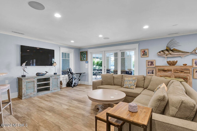 living room featuring crown molding, french doors, and light hardwood / wood-style flooring