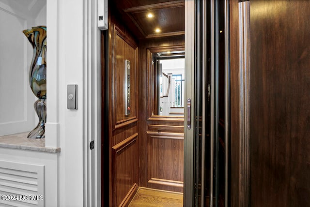 room details featuring hardwood / wood-style floors and elevator