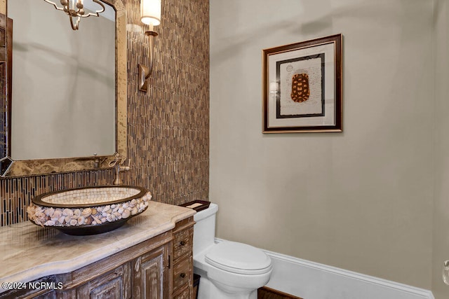 bathroom with toilet and vanity