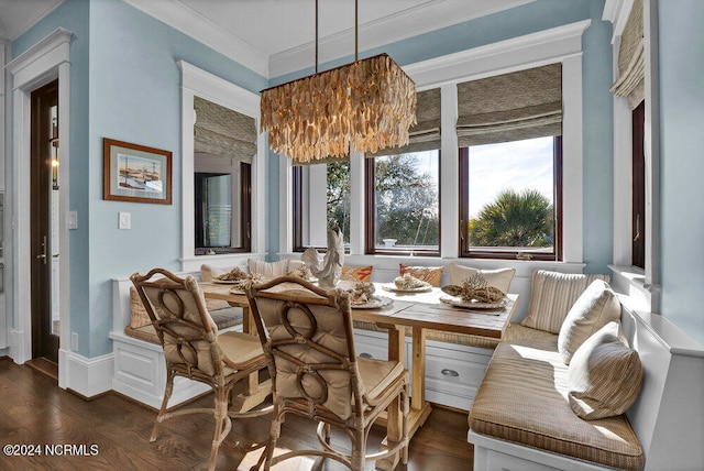 dining area with a chandelier and dark hardwood / wood-style flooring