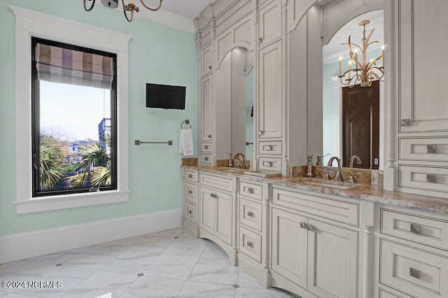 bathroom with tile floors, a notable chandelier, and vanity with extensive cabinet space