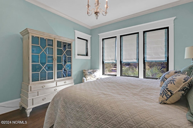 bedroom with dark hardwood / wood-style flooring, crown molding, and a notable chandelier