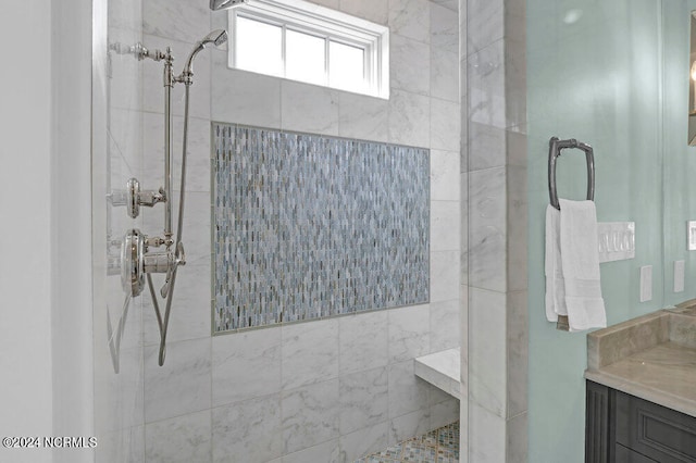 bathroom featuring a tile shower