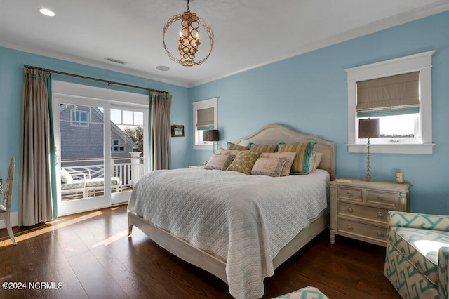 bedroom with dark hardwood / wood-style flooring, crown molding, and access to exterior