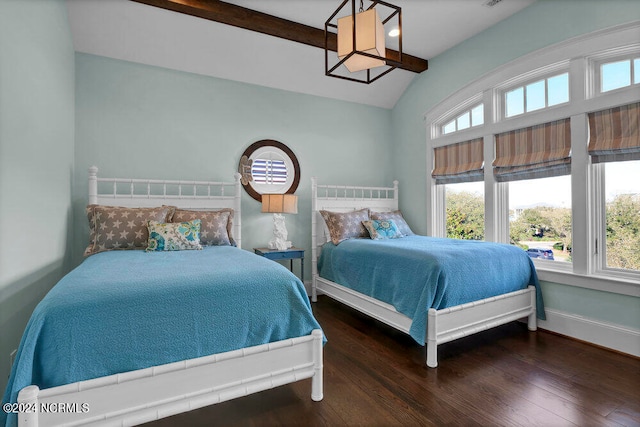 bedroom with dark hardwood / wood-style flooring and lofted ceiling with beams