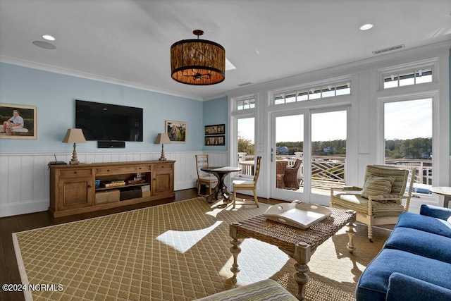 living room with crown molding, french doors, and dark hardwood / wood-style flooring