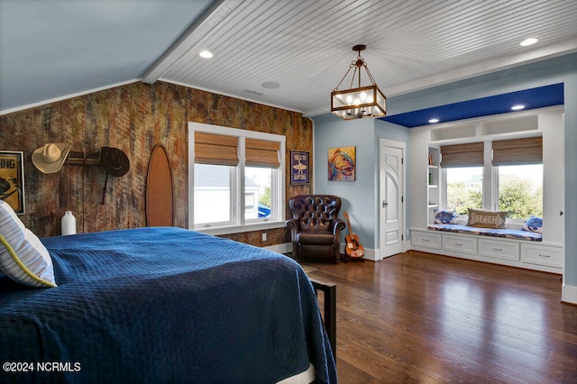 bedroom with a chandelier, dark wood-type flooring, and vaulted ceiling